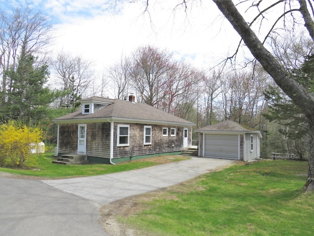 204 Clark Island Rd, Saint George, ME 04859 - view of front of home featuring an outbuilding, a garage, a chimney, a front yard, and a shingled roof