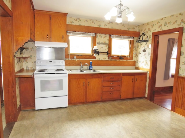 204 Clark Island Rd, Saint George, ME 04859 - kitchen with electric stove, a sink, extractor fan, wallpapered walls, and a chandelier