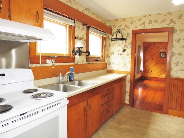 204 Clark Island Rd, Saint George, ME 04859 - kitchen featuring electric stove, a sink, wallpapered walls, under cabinet range hood, and light countertops