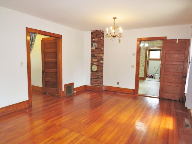 204 Clark Island Rd, Saint George, ME 04859 - unfurnished room featuring hardwood / wood-style flooring, baseboards, and a chandelier