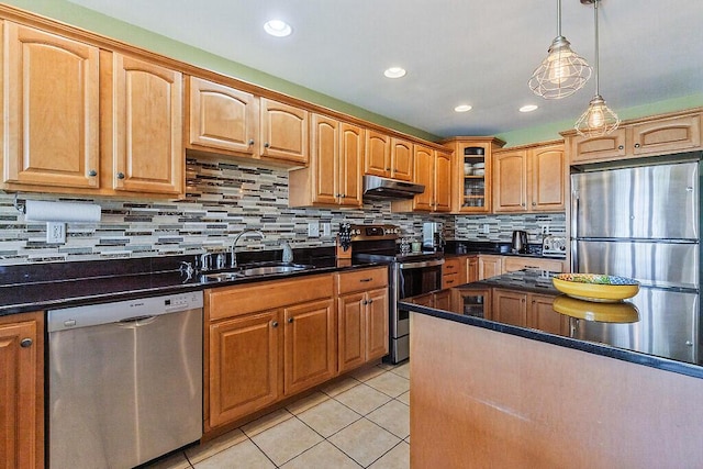 30 Royale Dr, Sidney, ME 04330 - kitchen featuring appliances with stainless steel finishes, a sink, under cabinet range hood, glass insert cabinets, and light tile patterned flooring