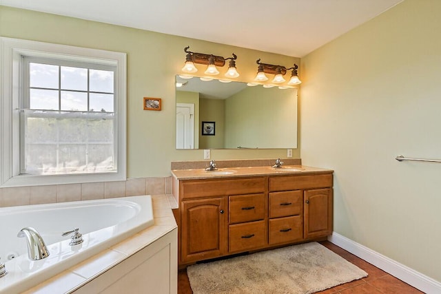 30 Royale Dr, Sidney, ME 04330 - bathroom featuring double vanity, a bath, baseboards, and tile patterned flooring