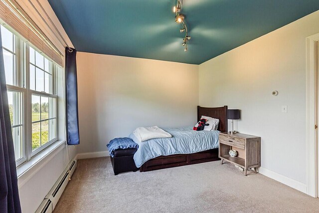 30 Royale Dr, Sidney, ME 04330 - bedroom with carpet floors, a baseboard heating unit, track lighting, and baseboards