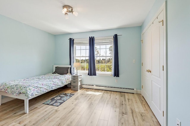 30 Royale Dr, Sidney, ME 04330 - bedroom featuring baseboard heating and wood finished floors