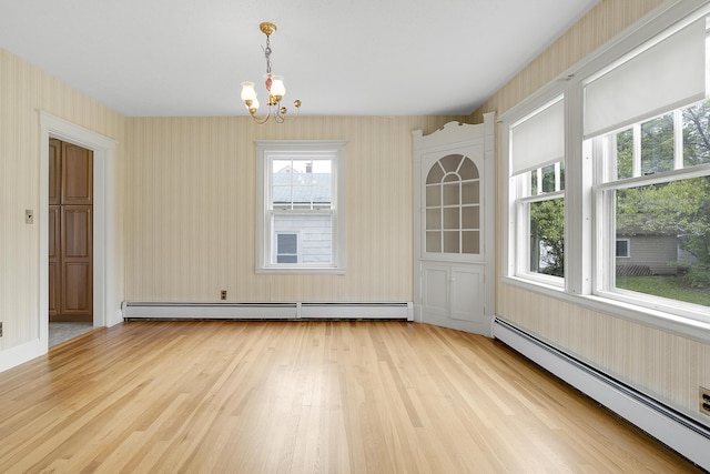 606 Main St, Sanford, ME 04083 - unfurnished dining area with baseboard heating, wallpapered walls, light wood-type flooring, a chandelier, and plenty of natural light