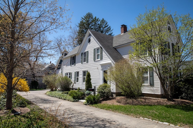11 Summer St, Kennebunk, ME 04043 - view of front of home featuring a chimney and roof with shingles