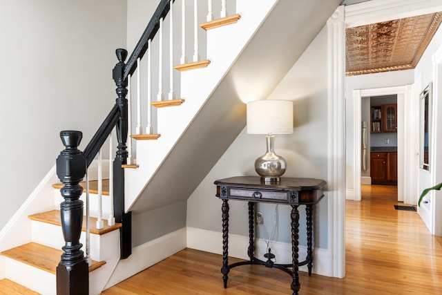 11 Summer St, Kennebunk, ME 04043 - stairs featuring wood finished floors and baseboards