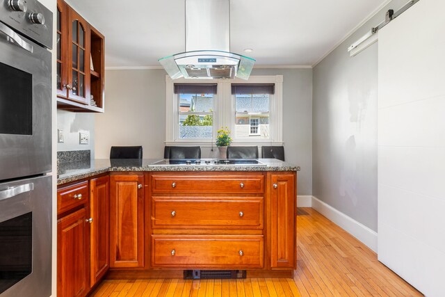 11 Summer St, Kennebunk, ME 04043 - kitchen featuring double oven, island range hood, light wood finished floors, ornamental molding, and electric stovetop