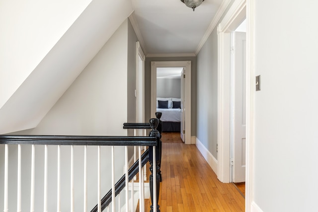 11 Summer St, Kennebunk, ME 04043 - corridor featuring light wood-type flooring, an upstairs landing, crown molding, and baseboards
