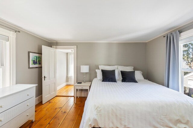 11 Summer St, Kennebunk, ME 04043 - bedroom with light wood-type flooring, baseboards, and crown molding