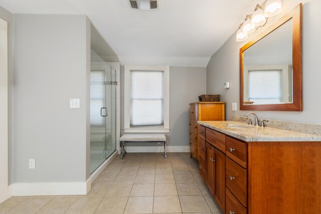 11 Summer St, Kennebunk, ME 04043 - bathroom with vanity, tile patterned floors, a shower stall, and baseboards