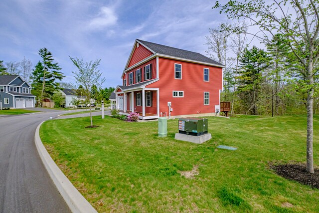 14 Bluebird Trl Unit 67, Falmouth, ME 04105 - view of front of property with a front lawn, asphalt driveway, and a deck