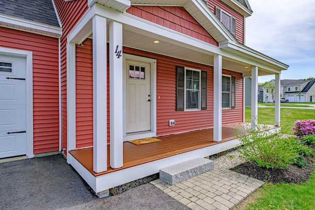 14 Bluebird Trl Unit 67, Falmouth, ME 04105 - property entrance featuring covered porch and roof with shingles
