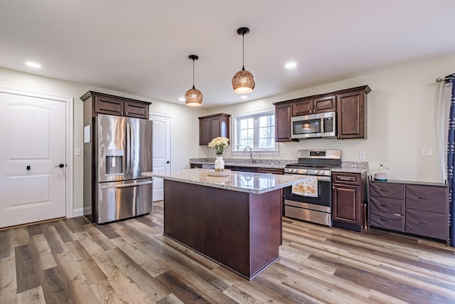 14 Bluebird Trl Unit 67, Falmouth, ME 04105 - kitchen featuring appliances with stainless steel finishes, dark brown cabinets, wood finished floors, and recessed lighting