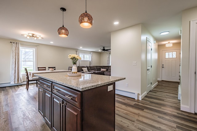 14 Bluebird Trl Unit 67, Falmouth, ME 04105 - kitchen featuring baseboard heating, dark wood-style floors, ceiling fan, pendant lighting, and dark brown cabinetry