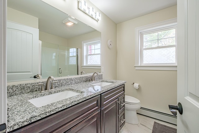 14 Bluebird Trl Unit 67, Falmouth, ME 04105 - full bathroom featuring a baseboard heating unit, marble look tiles, a shower stall, toilet, and double vanity