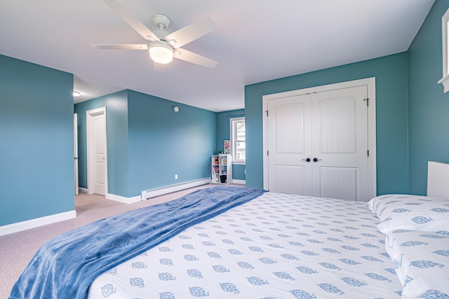 14 Bluebird Trl Unit 67, Falmouth, ME 04105 - carpeted bedroom with a baseboard heating unit, baseboards, a closet, and ceiling fan
