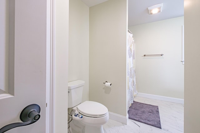 14 Bluebird Trl Unit 67, Falmouth, ME 04105 - bathroom with marble finish floors, toilet, baseboards, and a shower with shower curtain