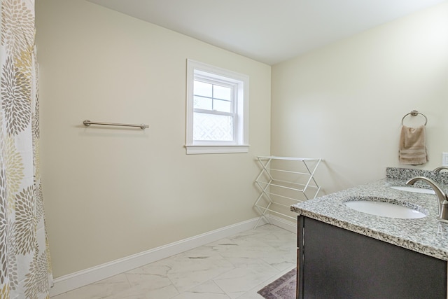 14 Bluebird Trl Unit 67, Falmouth, ME 04105 - full bath featuring marble finish flooring, baseboards, and double vanity