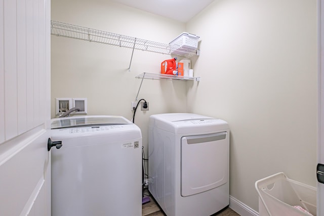 14 Bluebird Trl Unit 67, Falmouth, ME 04105 - clothes washing area with separate washer and dryer and wood finished floors