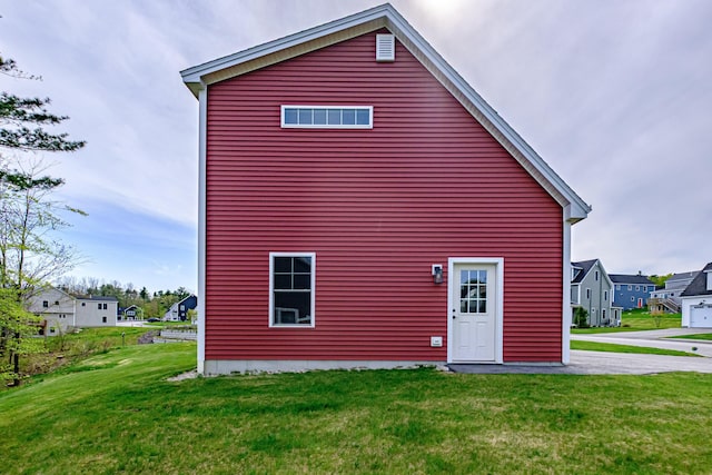 14 Bluebird Trl Unit 67, Falmouth, ME 04105 - rear view of house featuring a lawn and a residential view