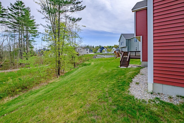 14 Bluebird Trl Unit 67, Falmouth, ME 04105 - view of green lawn with a residential view, stairway, and a deck
