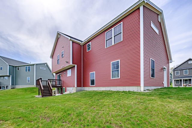 14 Bluebird Trl Unit 67, Falmouth, ME 04105 - rear view of house featuring stairs, a lawn, and a wooden deck