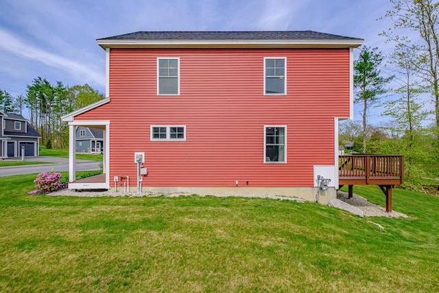 14 Bluebird Trl Unit 67, Falmouth, ME 04105 - view of side of property featuring a lawn and a wooden deck