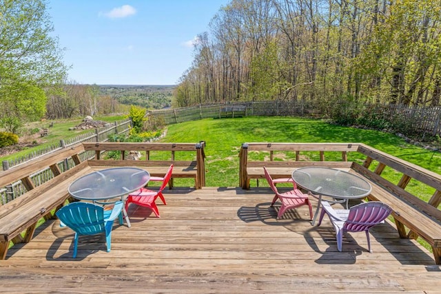 414 Oak Hill Rd, Litchfield, ME 04350 - wooden terrace with outdoor dining area and a wooded view