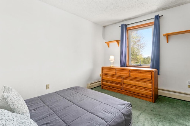 414 Oak Hill Rd, Litchfield, ME 04350 - carpeted bedroom with a baseboard radiator and a textured ceiling