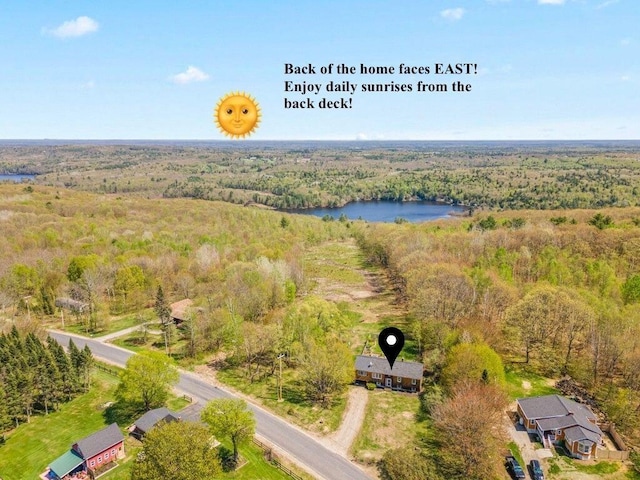 414 Oak Hill Rd, Litchfield, ME 04350 - drone / aerial view of a heavily wooded area and a large body of water