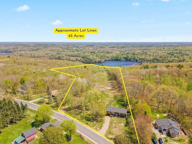 414 Oak Hill Rd, Litchfield, ME 04350 - aerial view of property's location with a forest, property boundaries highlighted, and a large body of water
