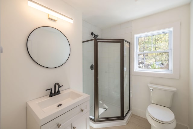 360 Vinal St, Rockport, ME 04856 - full bathroom featuring a stall shower, vanity, toilet, and baseboards