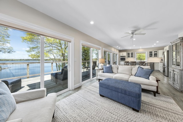 20 Delano Cove Rd, Friendship, ME 04547 - living room featuring a water view, ceiling fan, recessed lighting, and light wood-style floors