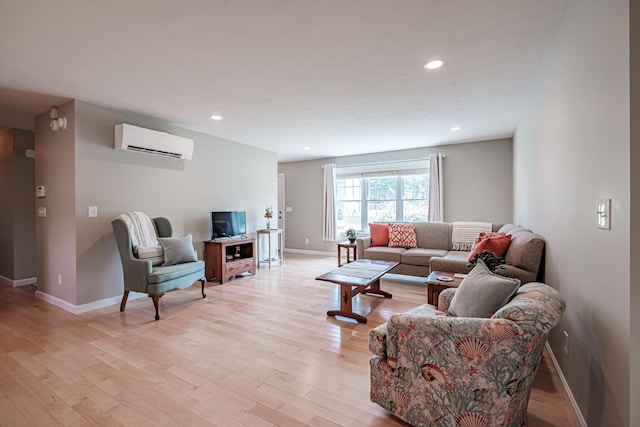 48 Sancho Dr, Saco, ME 04072 - living room featuring a wall mounted air conditioner, light wood-style floors, baseboards, and recessed lighting