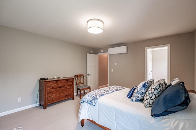 48 Sancho Dr, Saco, ME 04072 - bedroom featuring a wall unit AC, light carpet, and baseboards