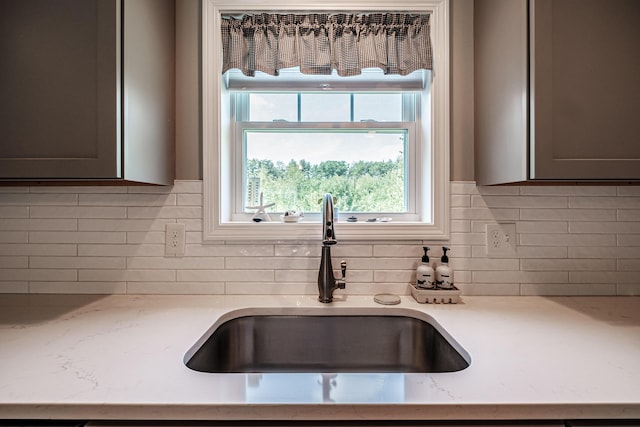 48 Sancho Dr, Saco, ME 04072 - kitchen with a sink, tasteful backsplash, light stone counters, and gray cabinets