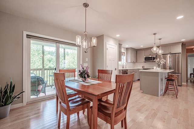 48 Sancho Dr, Saco, ME 04072 - dining room featuring healthy amount of natural light, light wood-style flooring, a chandelier, baseboards, and recessed lighting