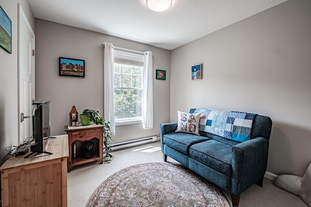 48 Sancho Dr, Saco, ME 04072 - living area with a baseboard heating unit, carpet, and baseboards