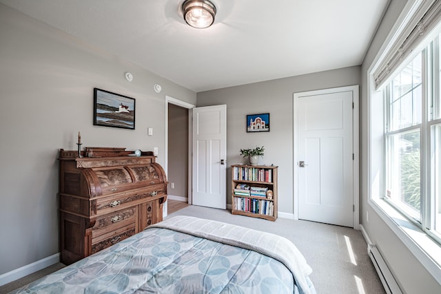 48 Sancho Dr, Saco, ME 04072 - bedroom with baseboard heating, multiple windows, and baseboards