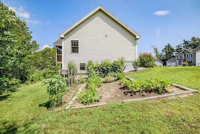 48 Sancho Dr, Saco, ME 04072 - view of side of property with a lawn and a vegetable garden