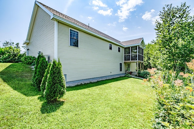 48 Sancho Dr, Saco, ME 04072 - rear view of house featuring a sunroom and a lawn