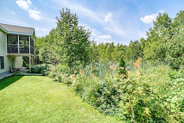 48 Sancho Dr, Saco, ME 04072 - view of green lawn featuring a sunroom