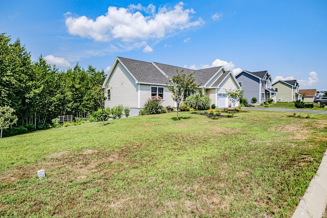 48 Sancho Dr, Saco, ME 04072 - view of front of home with a front lawn, an attached garage, and a residential view