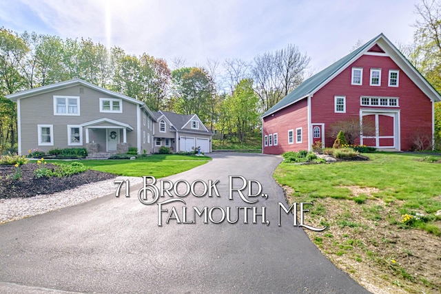 71 Brook Rd, Falmouth, ME 04105 - view of front facade with driveway, a front lawn, and a garage