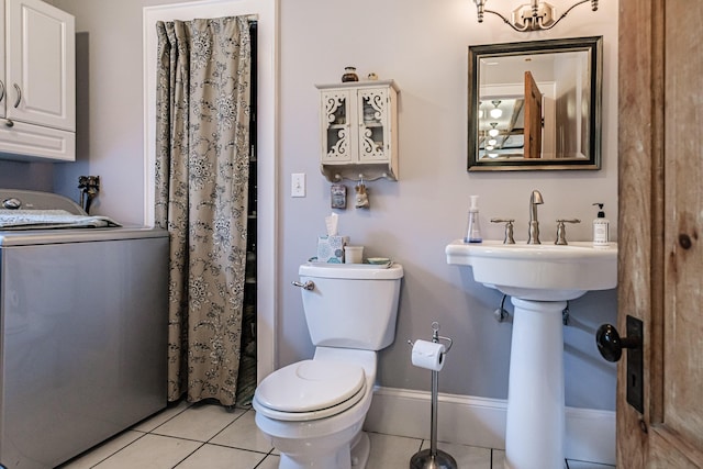 71 Brook Rd, Falmouth, ME 04105 - full bath featuring washer / clothes dryer, toilet, tile patterned floors, and baseboards