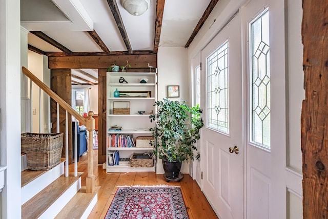 71 Brook Rd, Falmouth, ME 04105 - entryway featuring light wood-type flooring, plenty of natural light, stairway, and beamed ceiling