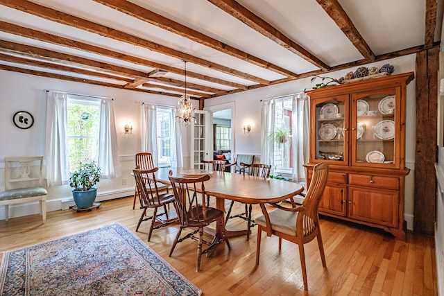 71 Brook Rd, Falmouth, ME 04105 - dining area featuring beam ceiling, a chandelier, light wood-type flooring, and a baseboard heating unit