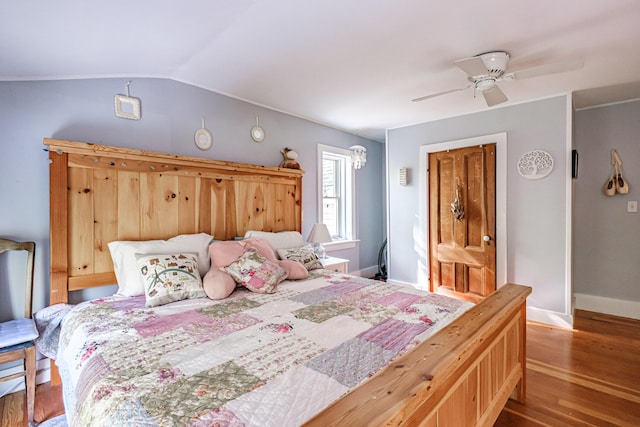 71 Brook Rd, Falmouth, ME 04105 - bedroom featuring wood finished floors, baseboards, vaulted ceiling, and a ceiling fan