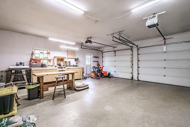 71 Brook Rd, Falmouth, ME 04105 - garage with a garage door opener and a workshop area